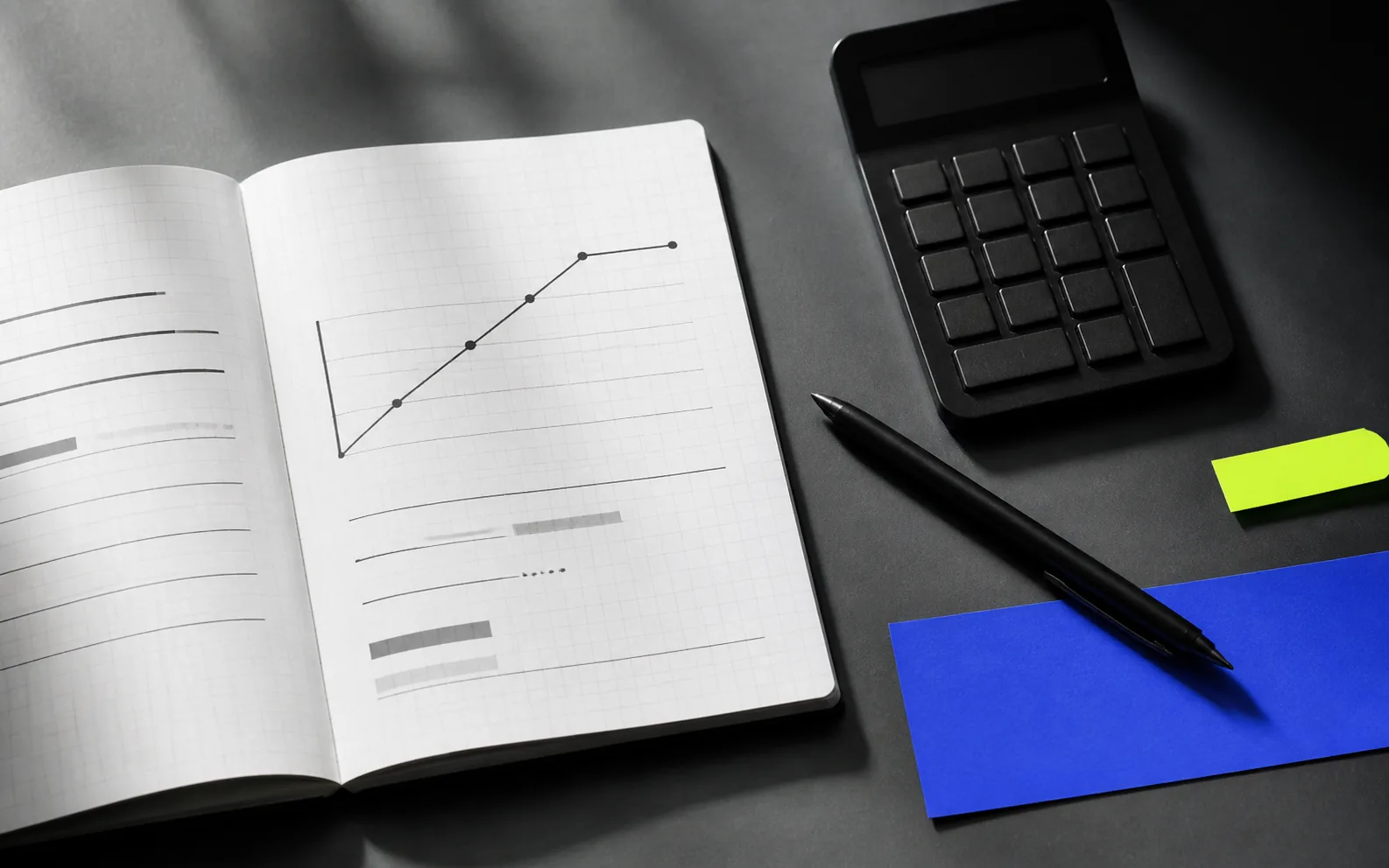 Calculator and documents on a desk – illustrative image of planning a loan
